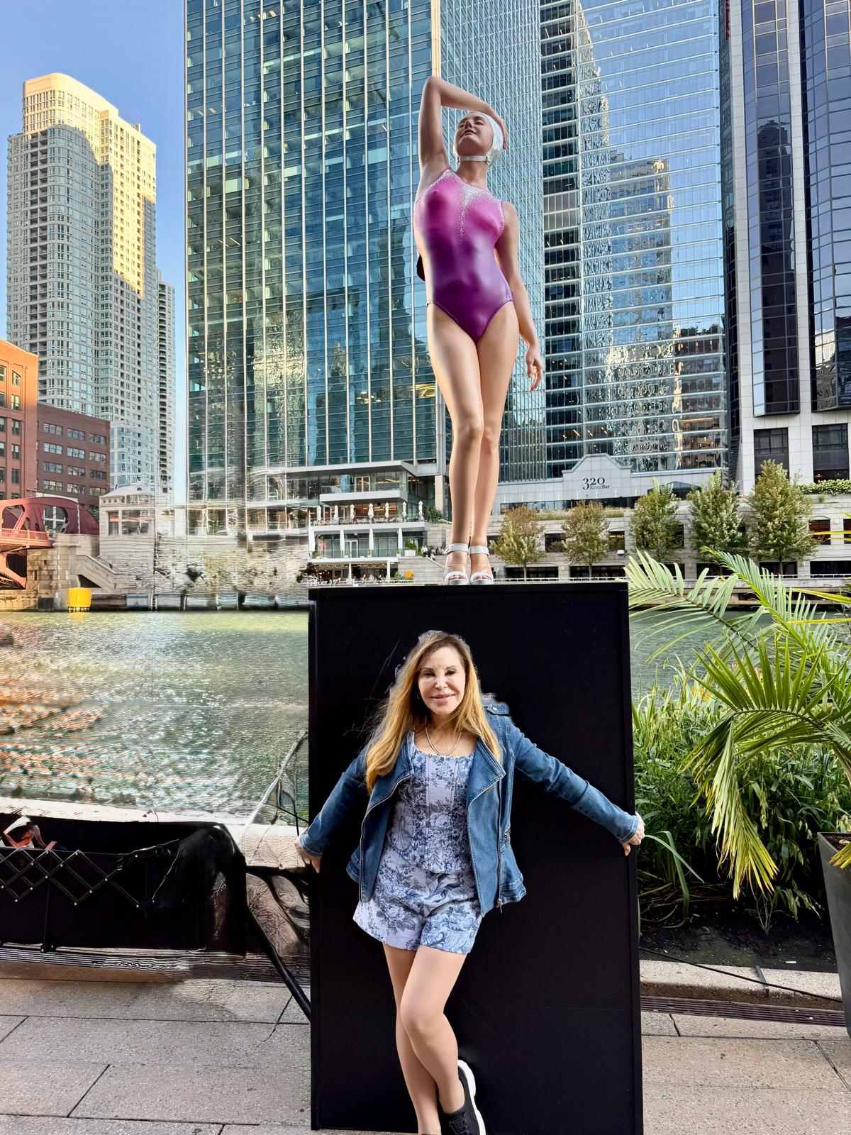 Carole A. Feuerman with her sculpture Christina on the Chicago Riverwalk